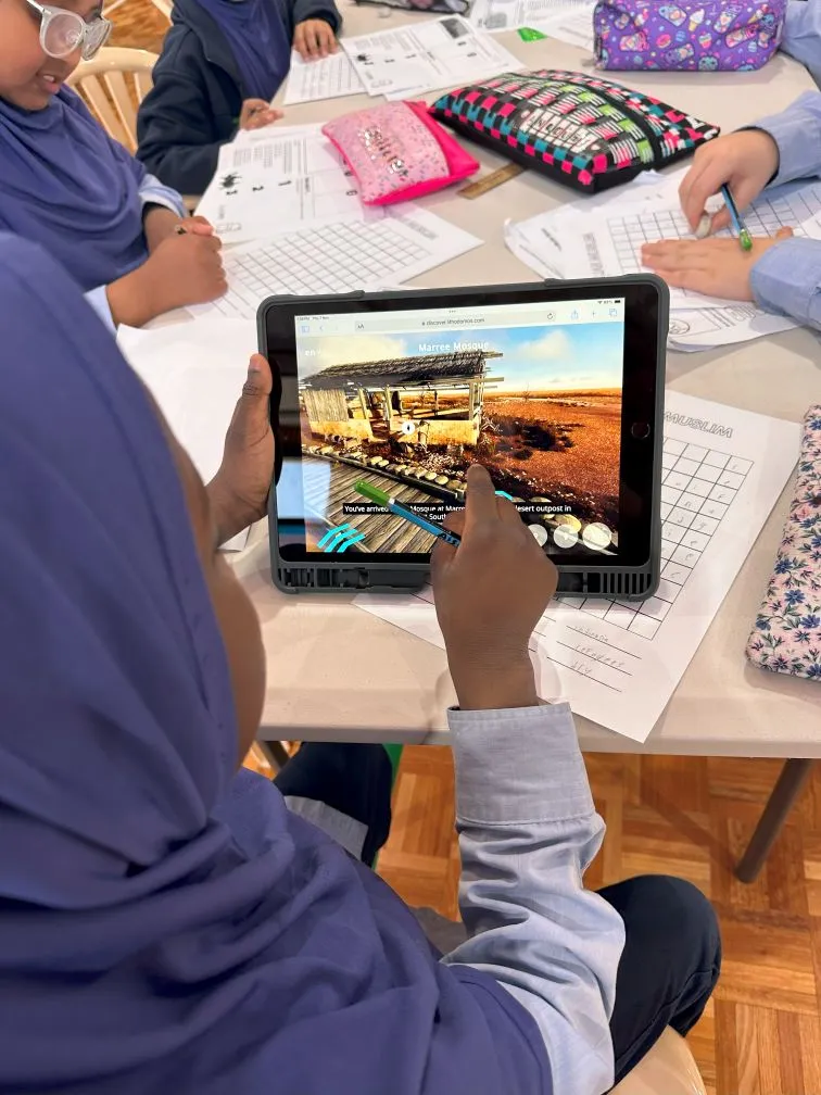 A student using a tablet during an incursion activity